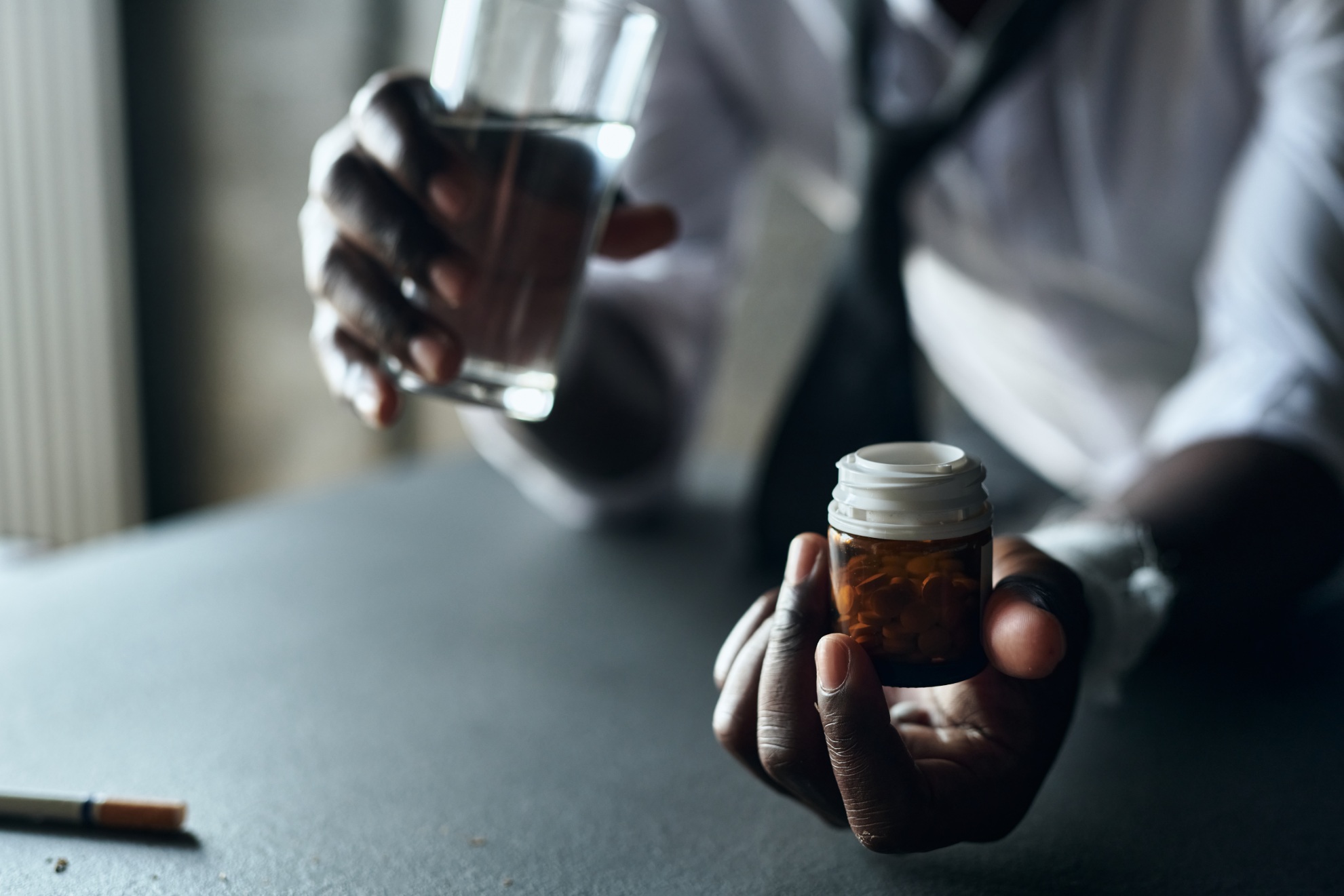 man-taking-antidepressants-with-water-2025-03-18-22-13-52-utc (1)